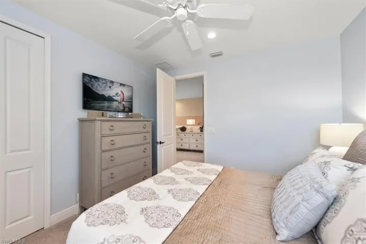 Carpeted bedroom with ceiling fan, recessed lighting, and baseboards
