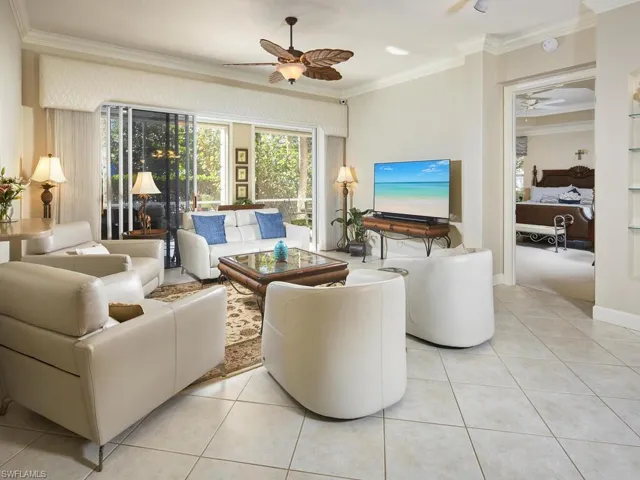 Large living room open to dining, custom barwith easy access to the quiet community pool.