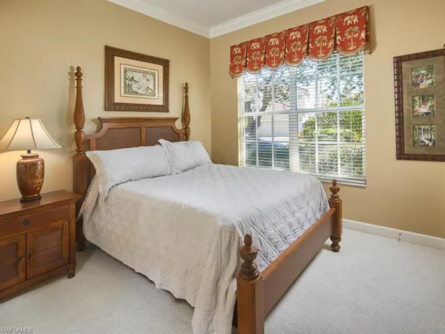 Cozy and inviting ensuite bedroom tuckedprivately away from the primary suite.