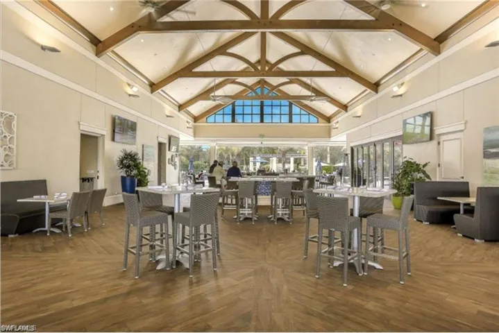 The Breezeway bar and restaurant overlooks a gorgeous resort style pool, also available for use with club membership.