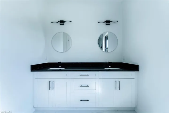 Bathroom featuring dual bowl vanity