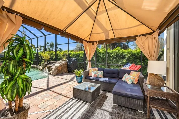Tented area off the pool for reading a book, and listening to the cascading waterfall!