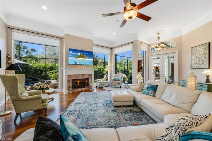 A large space with gas fireplace, large windows to gaze out to private oasis pool to preserve.