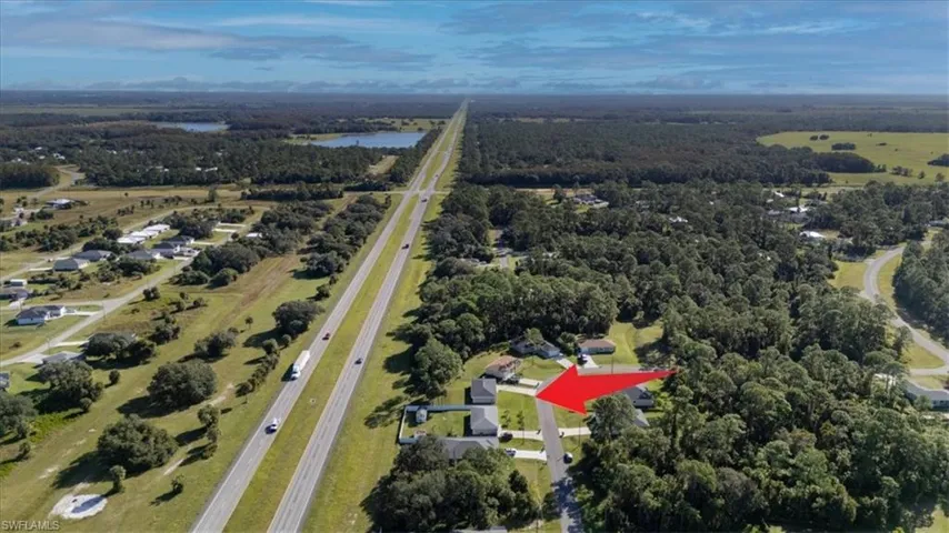 Aerial overview of property's location featuring a large body of water