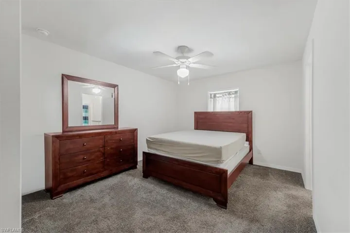 Bedroom featuring carpet and a ceiling fan