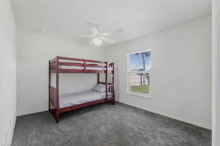 Bedroom featuring carpet floors and ceiling fan