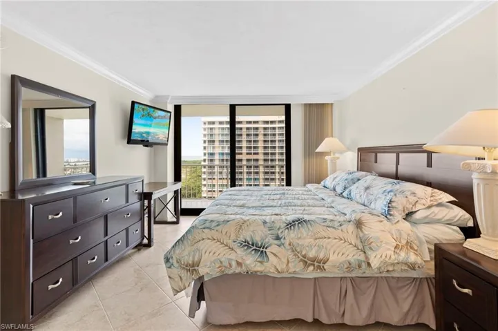 Tiled bedroom featuring ornamental molding