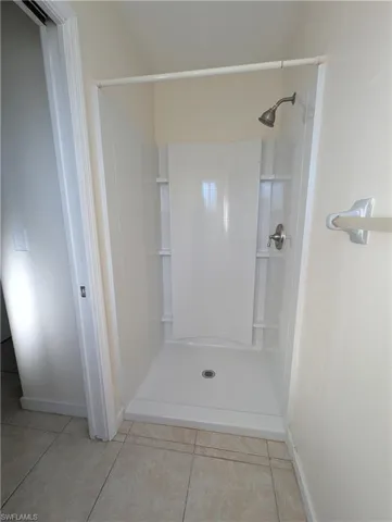 Full bathroom featuring tile patterned floors and a shower