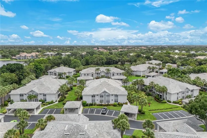 Expansive residential community featuring multiple multi-story buildings with light-colored roofs