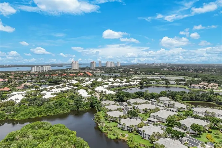 Aerial perspective showcasing a residential community with multiple lakes and lush landscaping