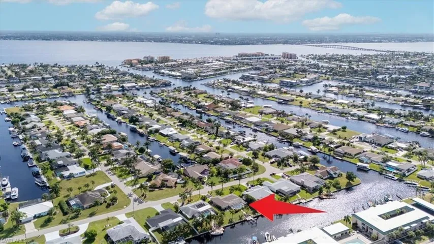 Aerial view of residential area with a nearby body of water