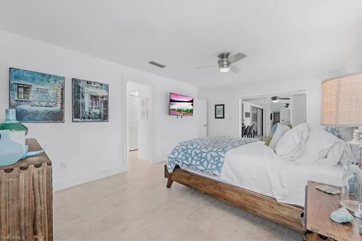 Bedroom featuring a ceiling fan and light tile patterned floors