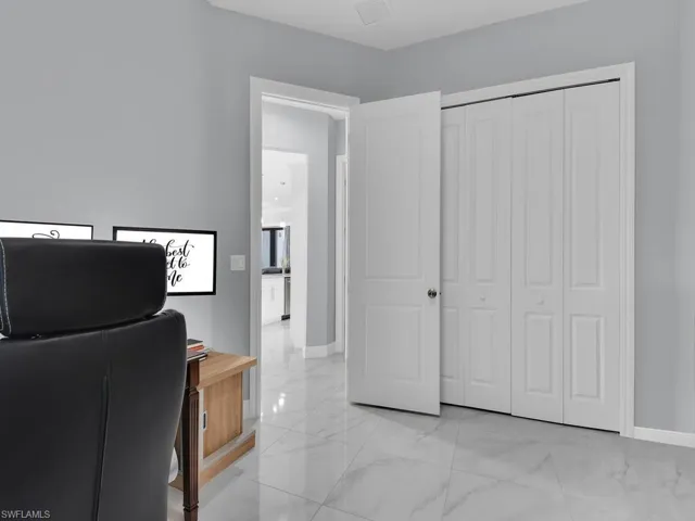 Office with visible vents, marble finish floor, and baseboards