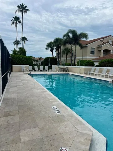 Community pool with a patio area