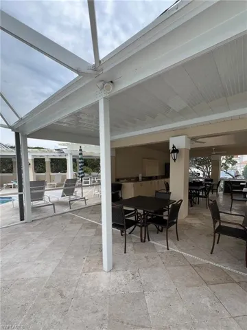View of patio / terrace featuring outdoor dining space and a community pool