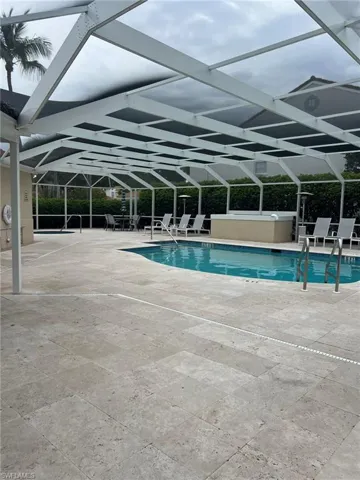 Community pool featuring a patio and a lanai