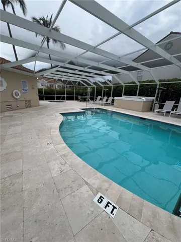 Community pool featuring a patio and a lanai