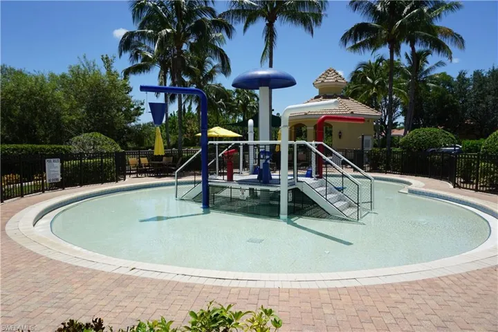 View of pool featuring a playground