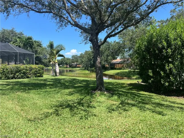View of backyard featuring a lake view