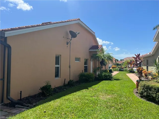 View of property exterior entry as seen from backyard