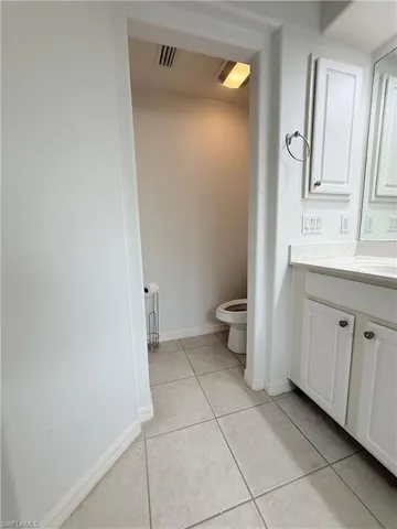 Bathroom with vanity and tile patterned floors