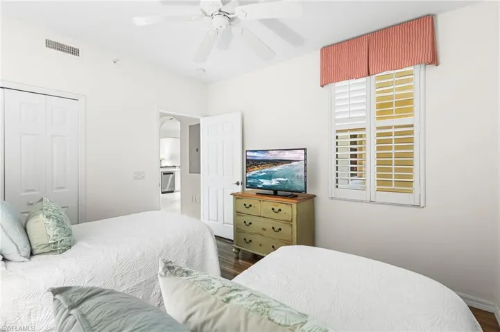 2nd bedroom offers twin beds. Plantation shutters.