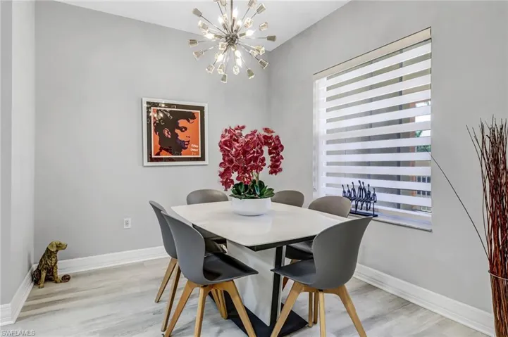 Dining area featuring an inviting chandelier and light hardwood / wood-style floors