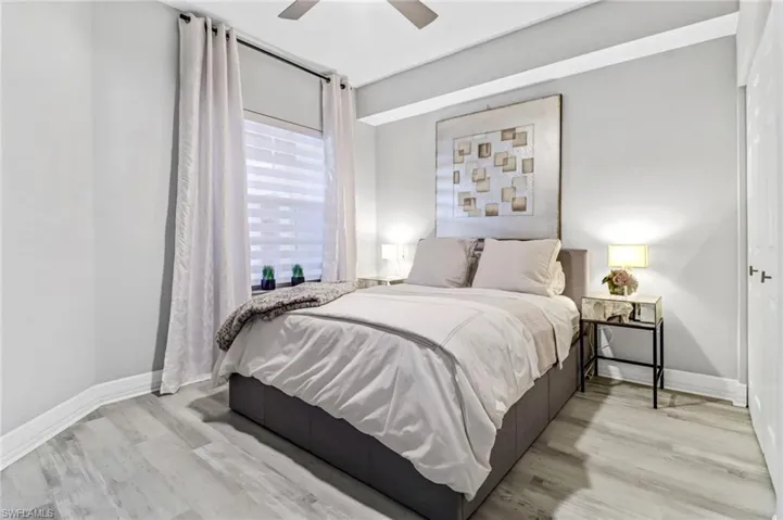 Bedroom featuring ceiling fan and light wood-type flooring