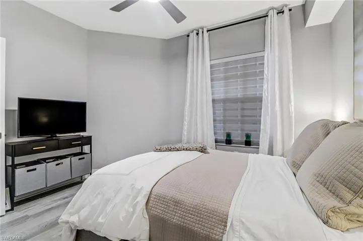 Bedroom with light wood-type flooring and ceiling fan