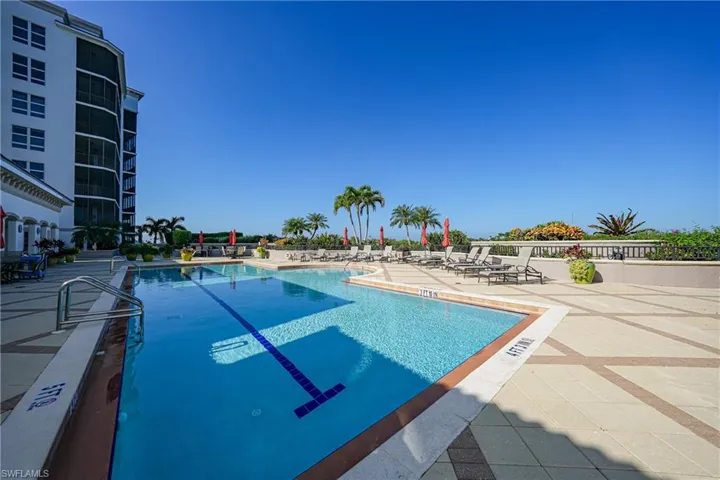 Community pool with a patio area