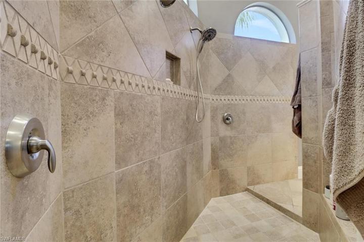 Carwash shower (two showerheads) is tiled.