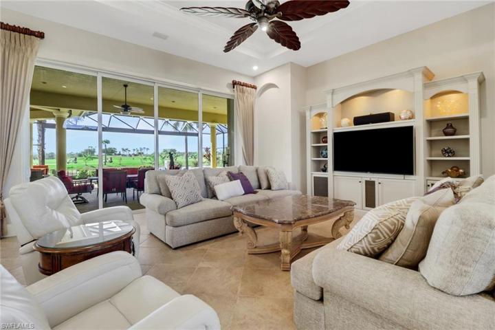 Spacious living room has disappearing sliders that open to allow indoor/outdoor living.