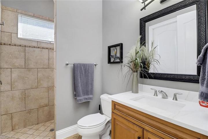 Guest bath shared by guest bedroom and office.