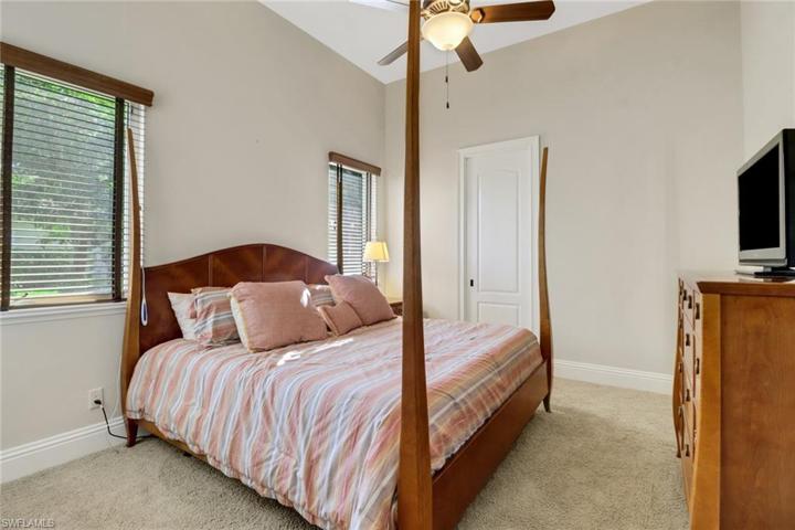 Guest bedroom with pocket door to bathroom.