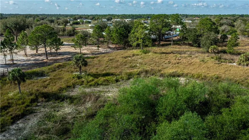 Birds eye view of property featuring a rural view