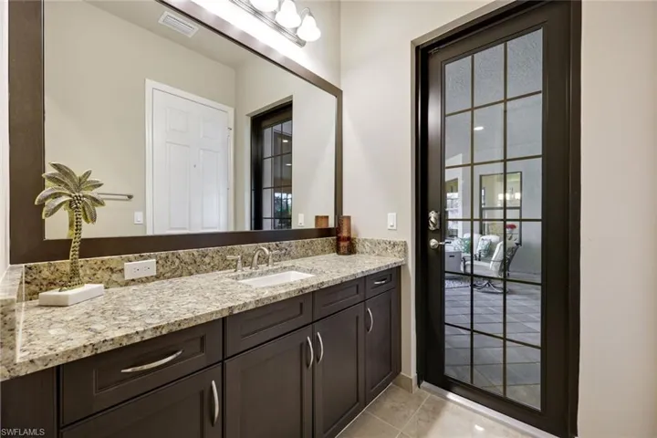 Pool Bath with Entryway to the Exterior Patio