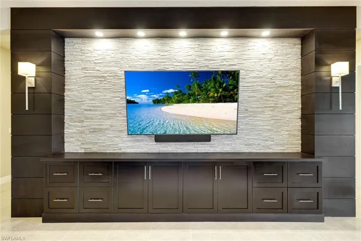 Gorgeous Solid Wood Entertainment Center with Stacked Stone Accent wall