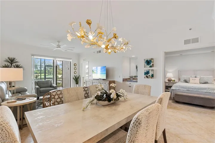 Looking to the open living area and bar area, den is flex for a bedroom or other living space
