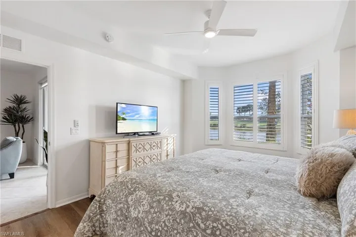 Primary Suite with beautiful natural light through windows overlooking the golf course