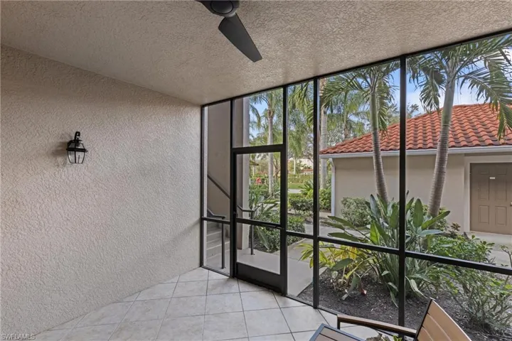 Front screened lanai with views between the building allowing for plenty of extra natural light
