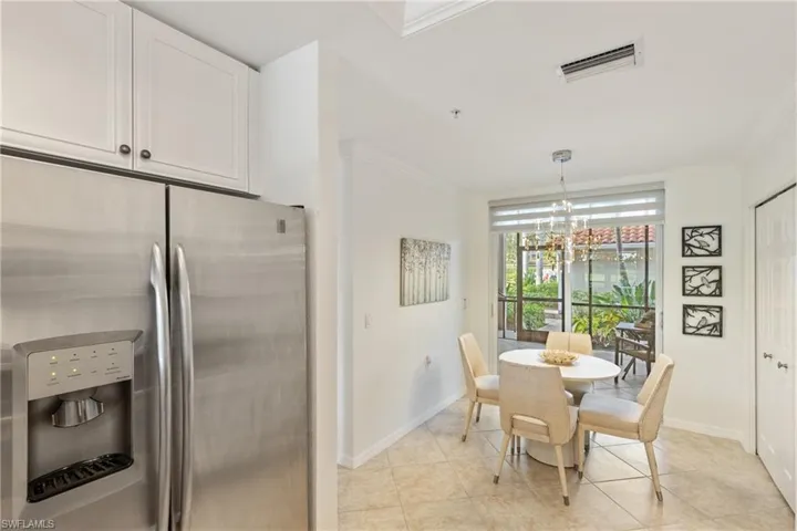 Breakfast nook and pantry space in the kitchen, overlooking the front lanai, a lot of natural light given the opening between buildings