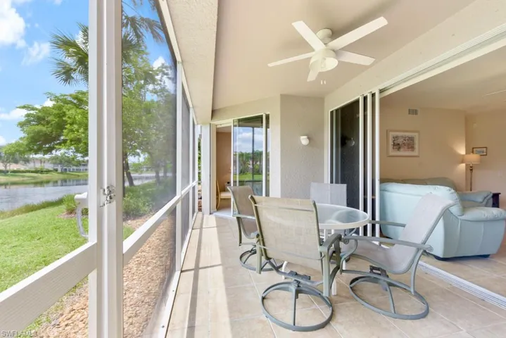 Lanai with ceiling fan and a water view