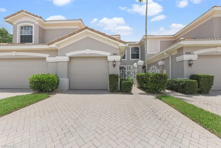 View of front of property with a garage