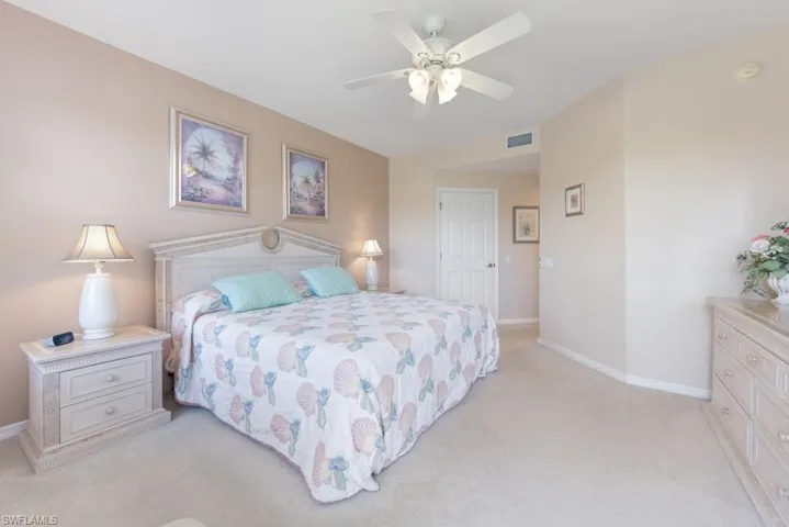 Bedroom featuring ceiling fan and light colored carpet