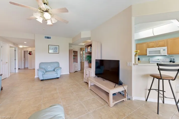 Tiled living room with ceiling fan