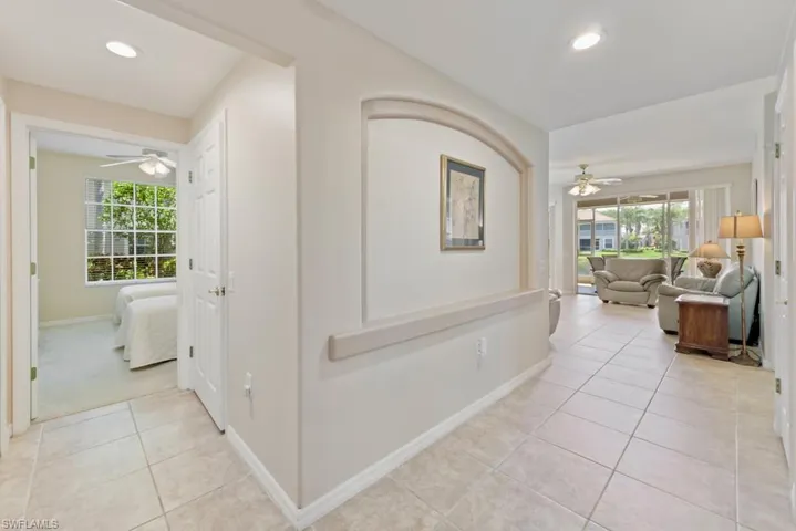 Hallway with light tile flooring