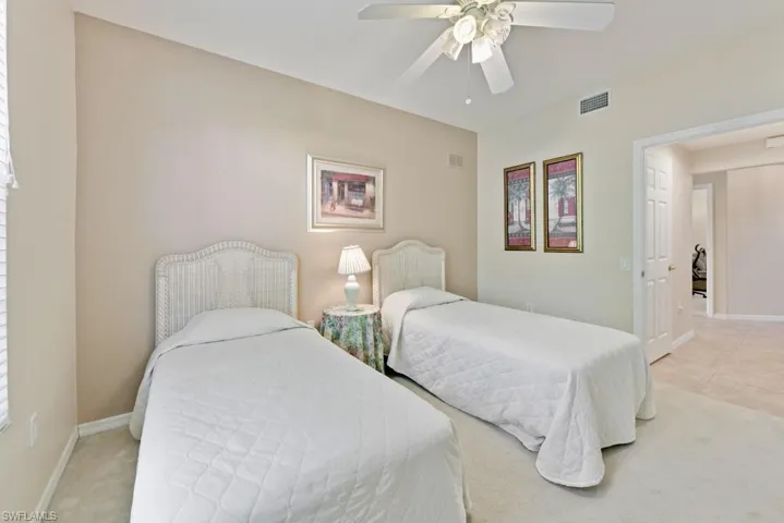 Bedroom featuring ceiling fan and carpet flooring