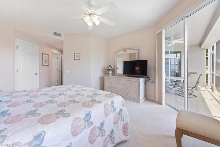 Bedroom featuring ceiling fan and light carpet