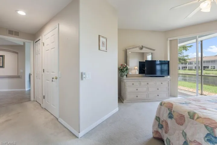 Bedroom featuring light carpet and ceiling fan