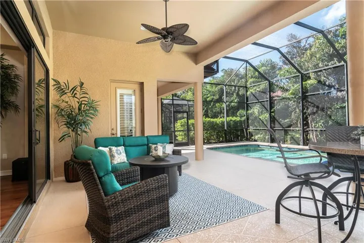 View of patio / terrace with glass enclosure, an outdoor living space, and ceiling fan